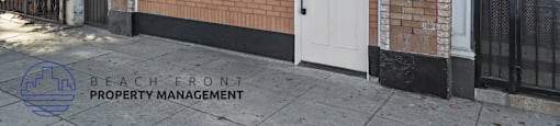 the front of a brick building with a white door