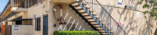 A building with a staircase leading to the second floor.