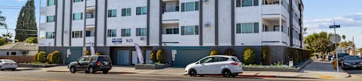 A building with the words Beach Front Property Management on the bottom left corner.