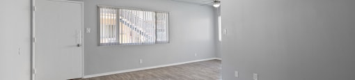 the living room and dining room of an apartment
