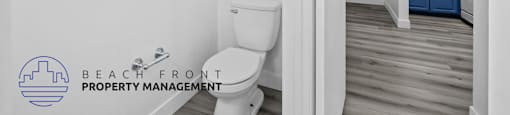a bathroom with a toilet and a sink in a house