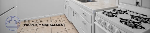 a white kitchen with white appliances and white cabinets
