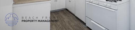 a white kitchen with white appliances and white cabinets