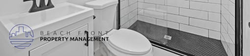 a bathroom with a toilet sink and shower and a mirror