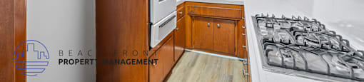 A kitchen with wooden cabinets and a stove top oven.
