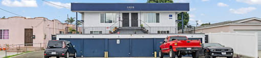 A blue building with a sign that says Beach Front Property Management.