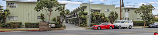 A street view with cars and buildings.