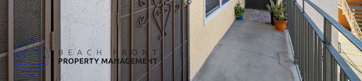 A balcony with a door and a window.