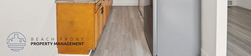 A kitchen with wooden cabinets and a granite countertop.