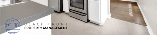 a kitchen with stainless steel appliances and a stove and refrigerator