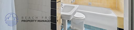 a bathroom with a tub and a sink and a window