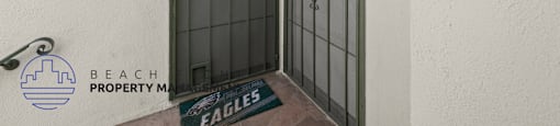 the door to the entrance of a building with metal doors