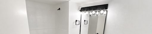 A white toilet sits next to a sink in a bathroom.