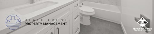 a white bathroom with a white sink and a toilet and a bath tub