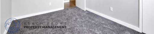 a bedroom with a carpeted floor and a ceiling fan