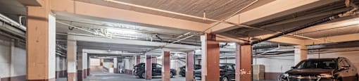 a parking garage with cars parked in it