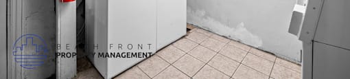 a laundry room with a washing machine and a fire hydrant