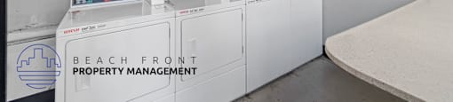 A laundry room with washers and dryers and a sign that says Beach Front Property Management.