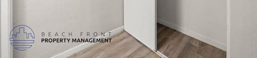 A white closet with a logo of Beach Front Property Management.
