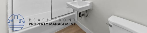 a bathroom with a shower and a sink and a mirror