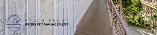 a balcony with a white door on the side of a building