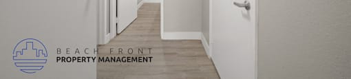 a renovated hallway with white walls and wood flooring and a door to a closet