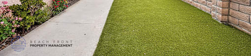 A long building with a lawn in front.
