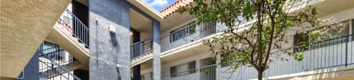 the courtyard of the beach front property management building