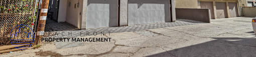 A building with the words "Beach Front Property Management" on the front.