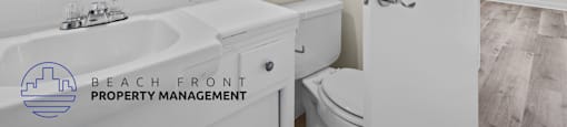 a white bathroom with a sink and a toilet