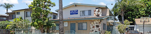 A house with a blue sign on the front.