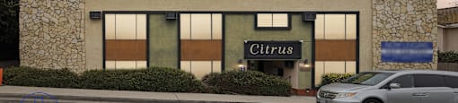 A building with the name Citrus on it is shown with a car parked in front.