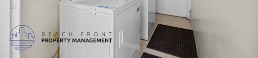 a laundry room with two washing machines and a door