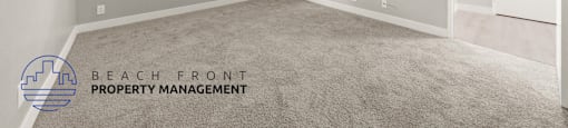 the spacious living room of a manufactured home with carpeting and a window