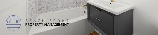 a bathroom with a sink and a tub and a mirror