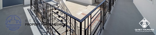 a view of the balconies of a building from the top of a staircase