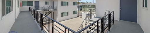 a view of the balcony of a building with a blue sky