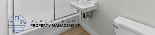 a bathroom with a shower and a sink and a mirror