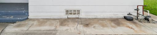 A white house with a window and a door.