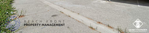 the beach front property management office is located on the side of the building