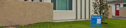 A sign in front of a house that says "New Learning".