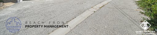 the beach front property management office is located on the side of the building