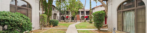 A row of houses with a sign that says Beach Front Property Management.