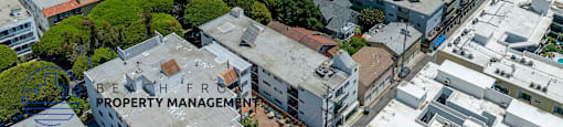 A bird's eye view of a cityscape with buildings and trees.
