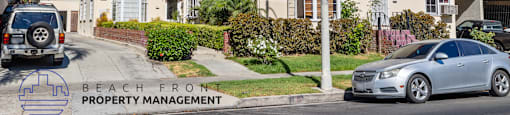 an image of a house with a car parked in front of it