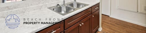 A kitchen with a sink and cabinets.