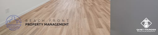 the living room and kitchen of a new home with wood flooring