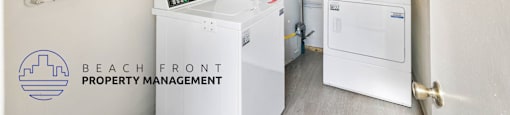 the laundry room has a washer and dryer and a water heater