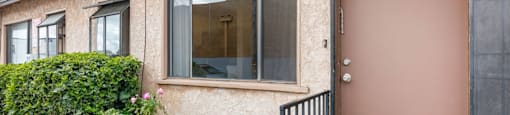 a building with a brown door and a glass window