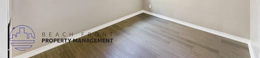 an empty room with a ceiling fan and a window
